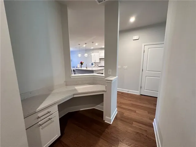 a view of cabinets and wooden floor