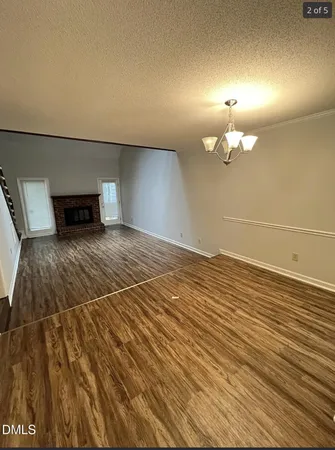 a view of a livingroom with wooden floor
