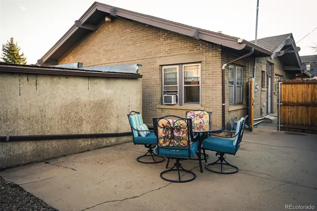 a view of a house with table and chairs