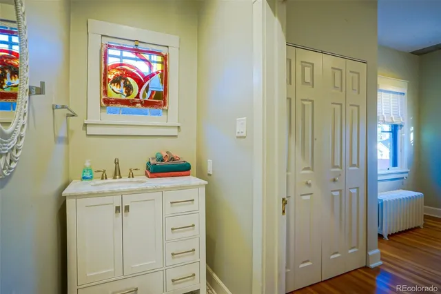 a room with cabinets and wooden floor