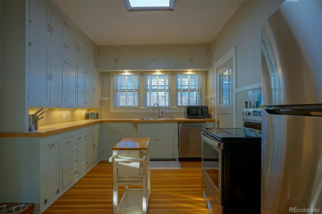 a kitchen with sink cabinets and window