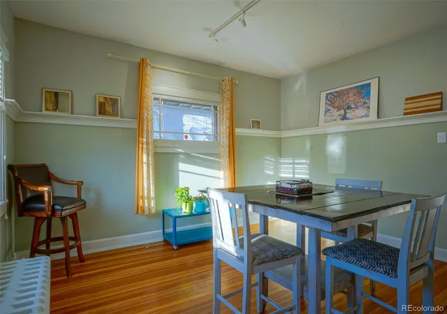 a workspace with furniture and wooden floor