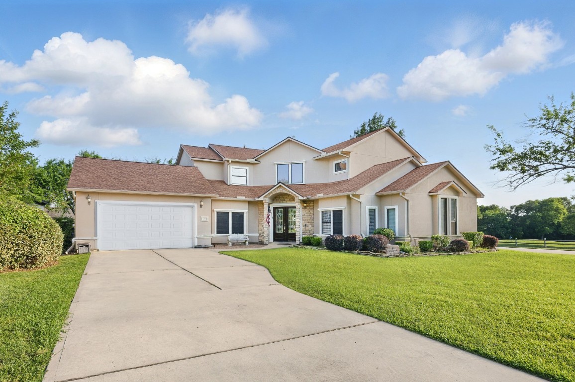 90 Greenview Street Montgomery, TX 77356 - Photo 1 of 34 a front view of house with yard and green space