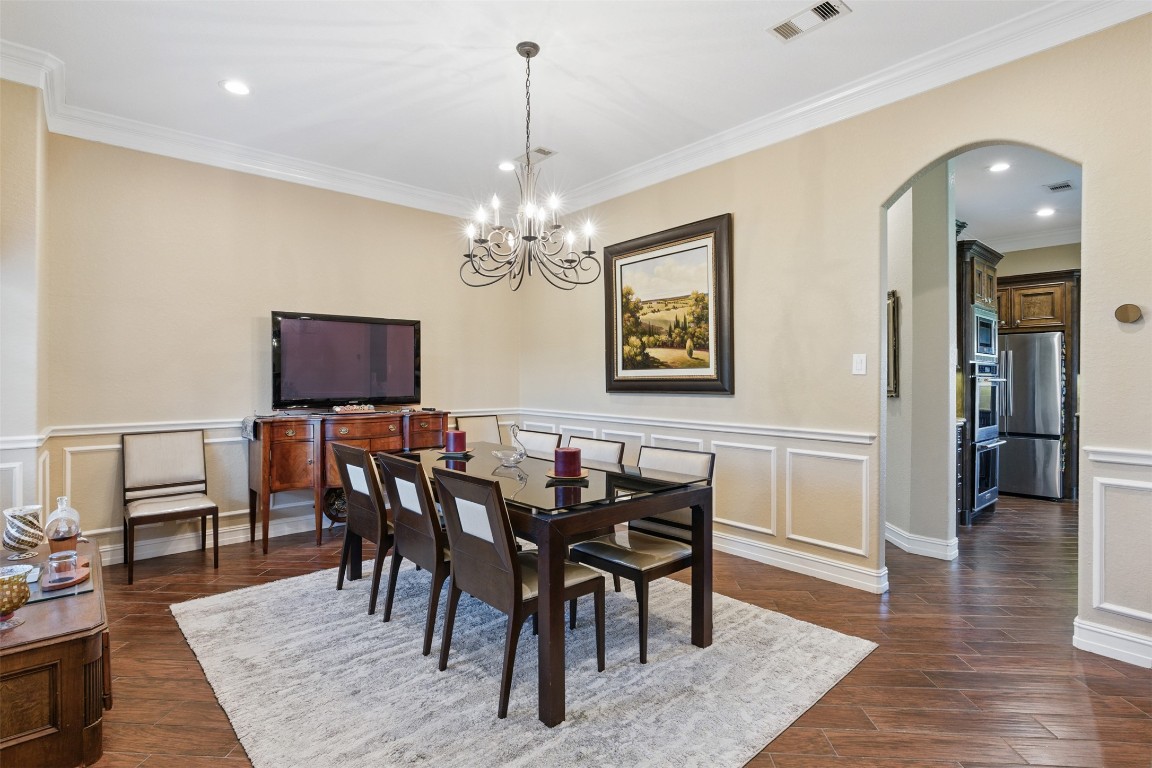 90 Greenview Street Montgomery, TX 77356 - Photo 12 of 34 a view of a dining room with furniture and wooden floor