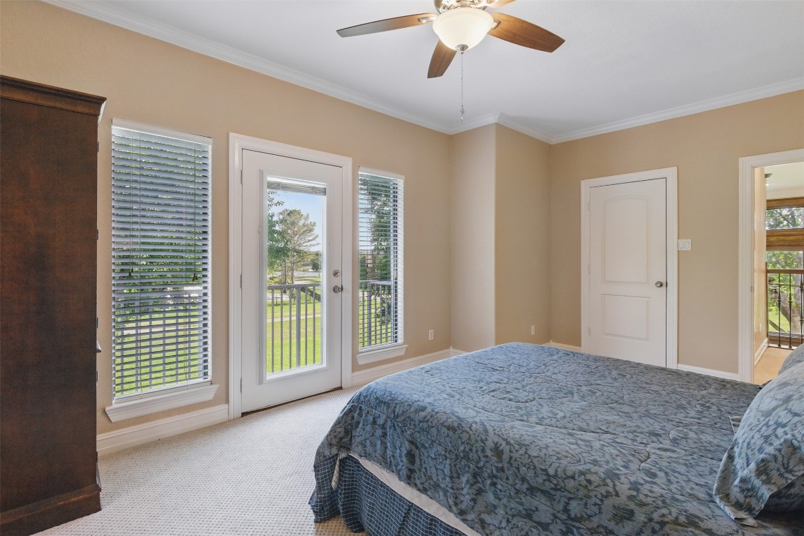 90 Greenview Street Montgomery, TX 77356 - Photo 27 of 34 a bedroom with a large bed and a large window