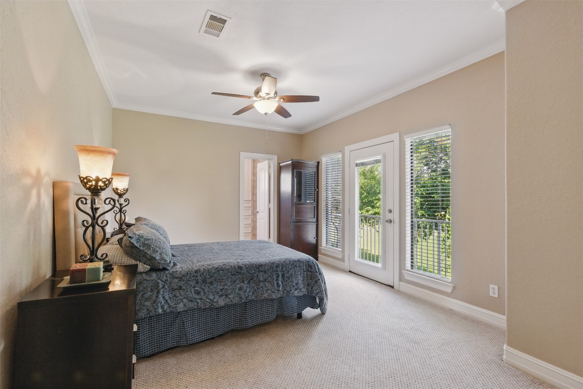 90 Greenview Street Montgomery, TX 77356 - Photo 28 of 34 a bedroom with a bed dresser and a window