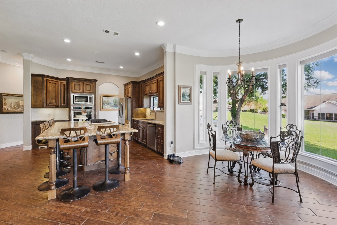 90 Greenview Street Montgomery, TX 77356 - Photo 7 of 34 a view of a dining room with furniture window and wooden floor