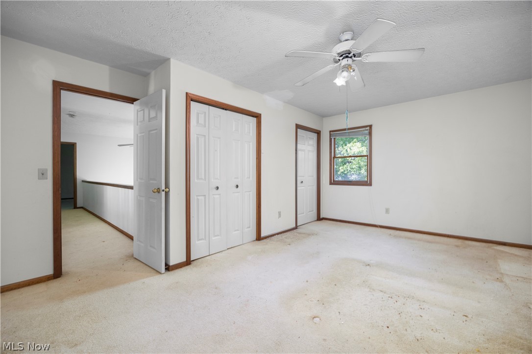 722 Jaycox Road Avon Lake, OH 44012 - Photo 30 of 48 Carpeted room with a ceiling fan, a window, and two bi-fold closets