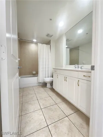 a bathroom with a sink a mirror and a shower