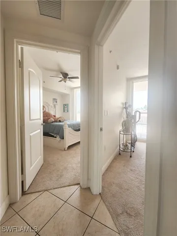 a view of a hallway with a furniture and a livingroom view