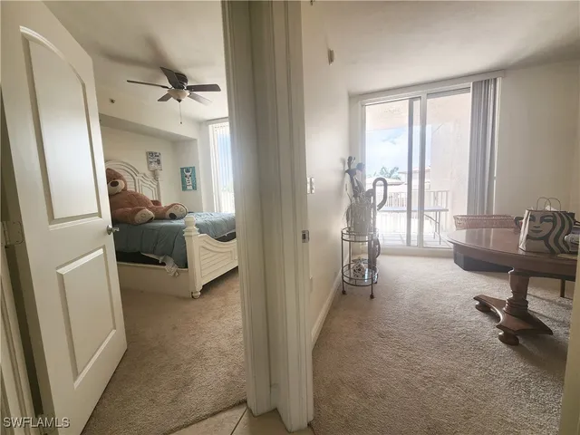 a view of a livingroom with furniture and a window