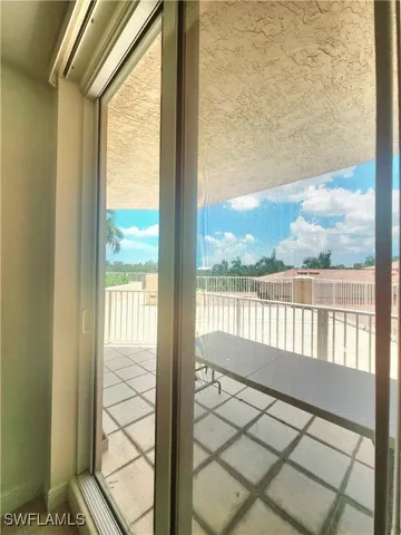 a view of a balcony with wooden floor