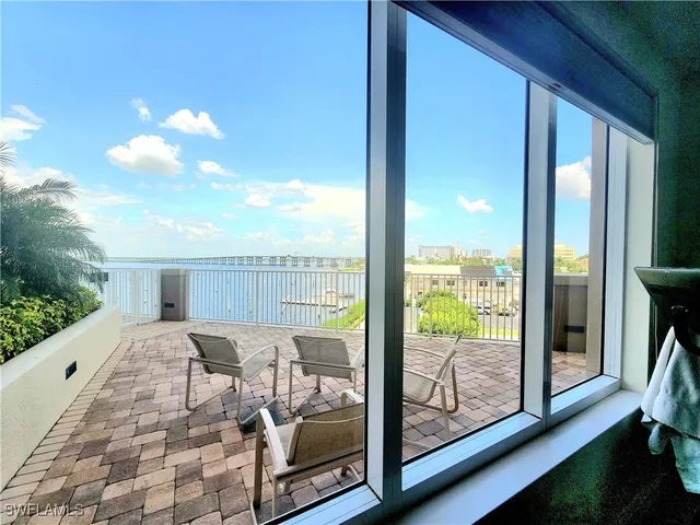 a view of a balcony with furniture