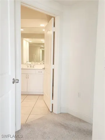 a view of a bathroom with mirror