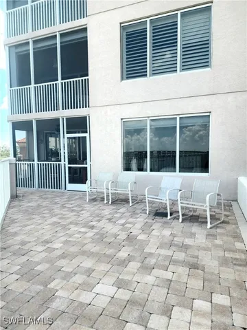 a bench sitting in front of a house