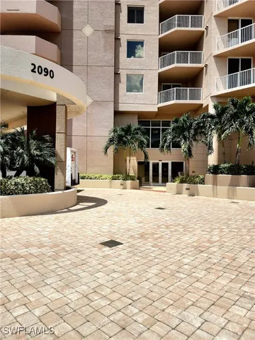 a view of houses with a street