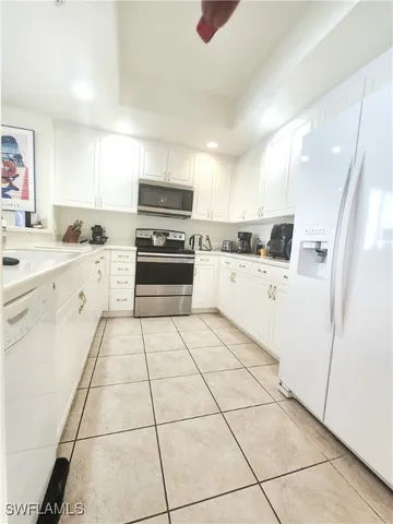 a kitchen with stainless steel appliances appliances cabinets and a sink