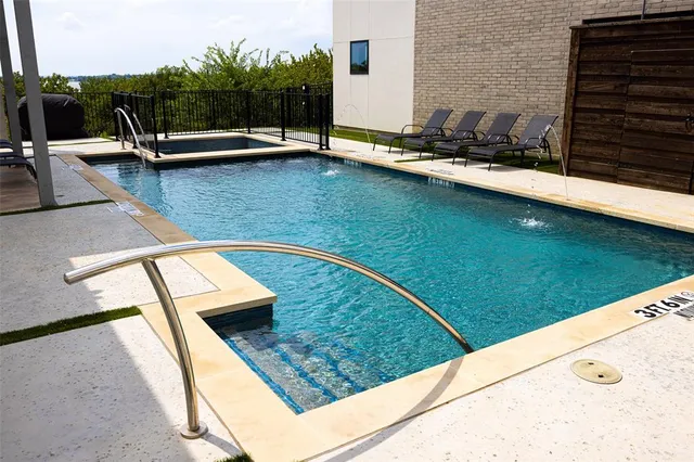 a view of a swimming pool with a patio