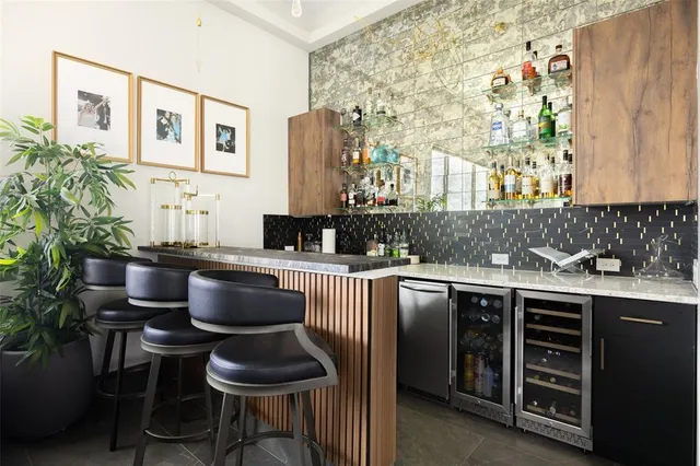 a kitchen with stainless steel appliances a sink and a stove