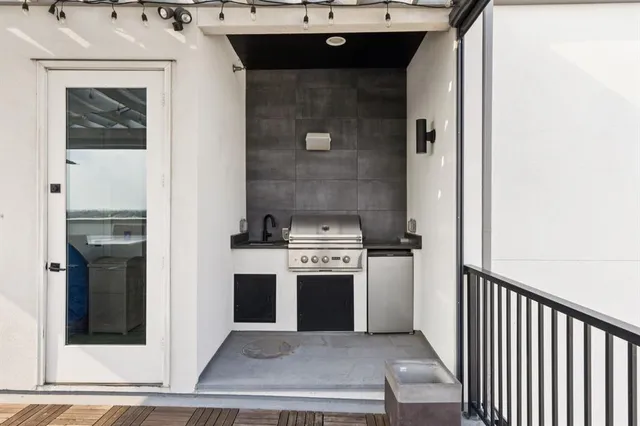 a stove top oven sitting inside of a kitchen