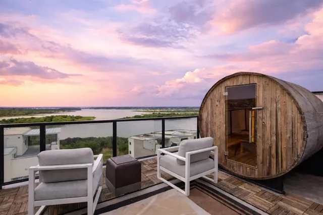 swimming pool view with a seating space