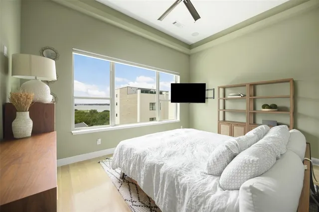 a bedroom with a bed and a television