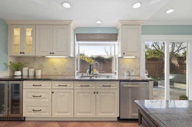 122 Jaybee Place San Jose, CA 95123 - Photo 13 of 40 a kitchen with granite countertop a sink and white cabinets