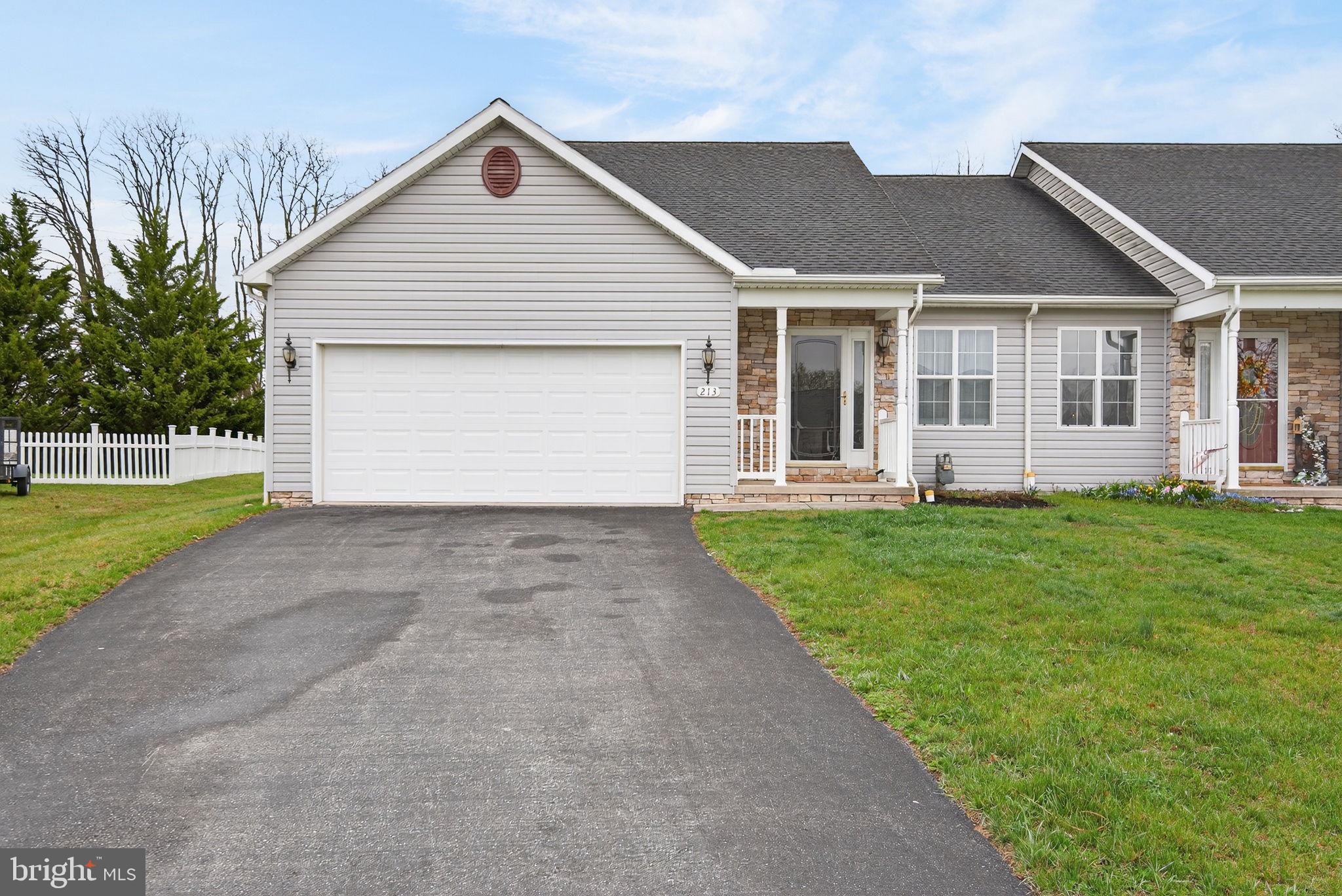 a view of a yard in front view of a house