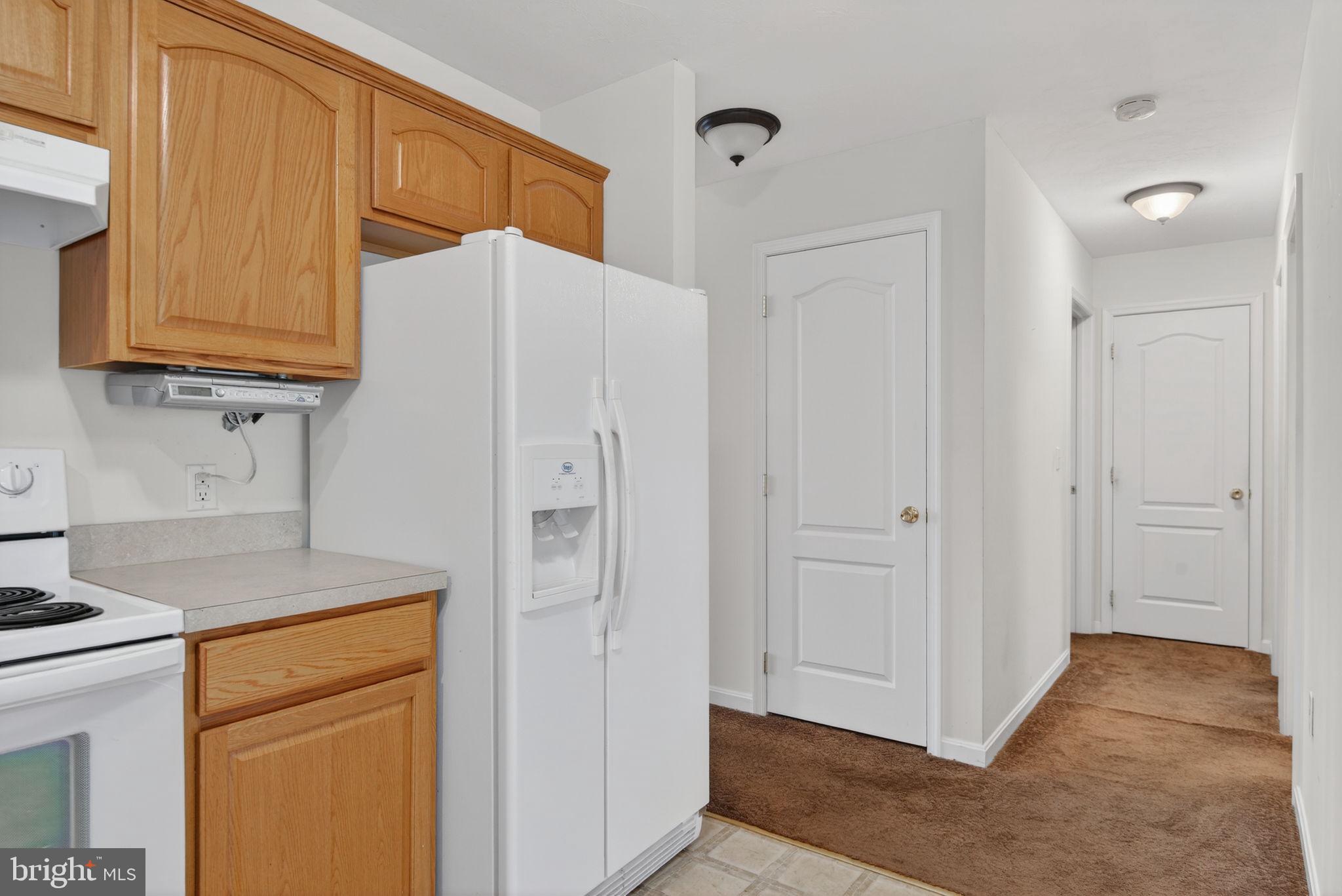 213 Maple Drive Hanover, PA 17331 - Photo 12 of 24 a kitchen with a refrigerator sink and cabinets