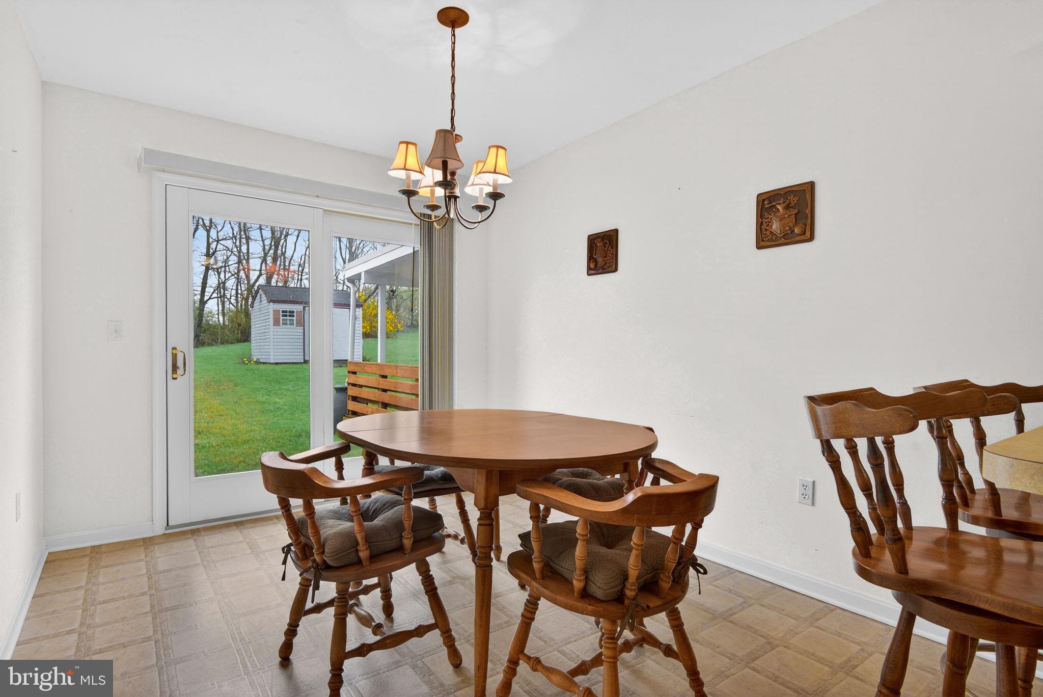 213 Maple Drive Hanover, PA 17331 - Photo 13 of 24 a view of a dining room with furniture and a chandelier