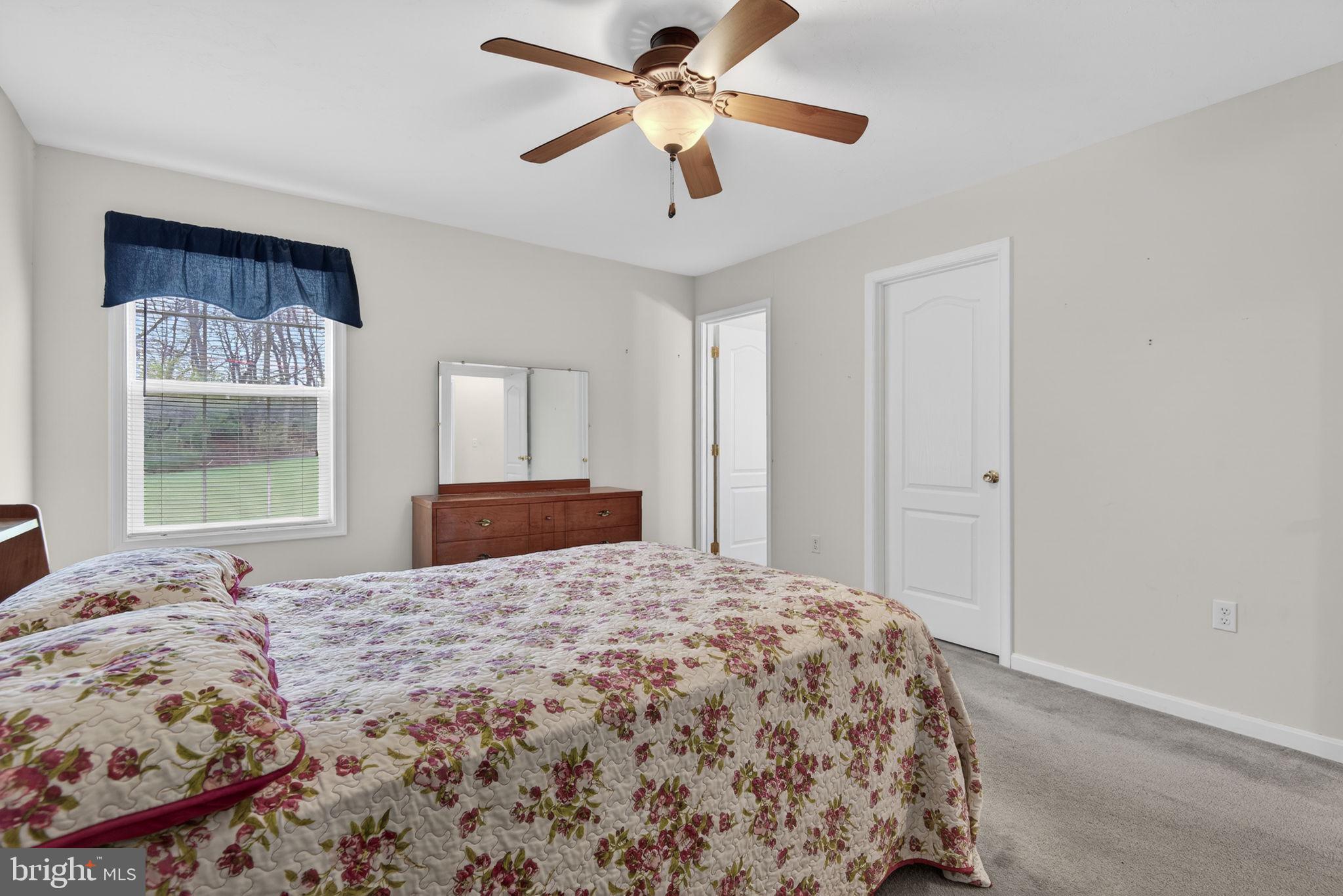 213 Maple Drive Hanover, PA 17331 - Photo 17 of 24 a bedroom with a large bed and a window