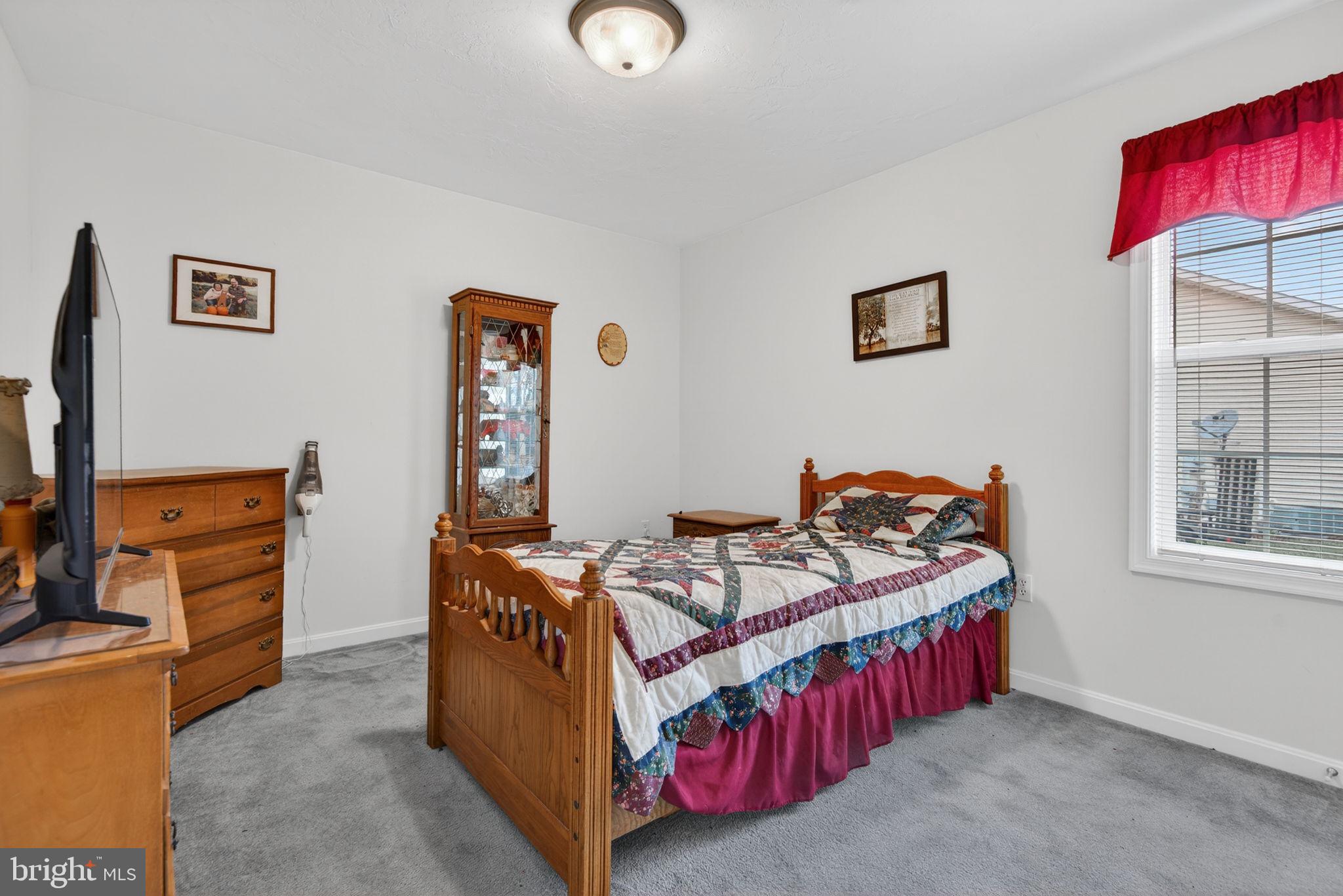 213 Maple Drive Hanover, PA 17331 - Photo 19 of 24 a bedroom with bed and a window