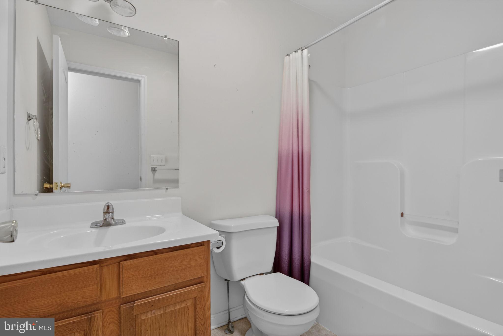 213 Maple Drive Hanover, PA 17331 - Photo 21 of 24 a bathroom with a sink toilet and shower