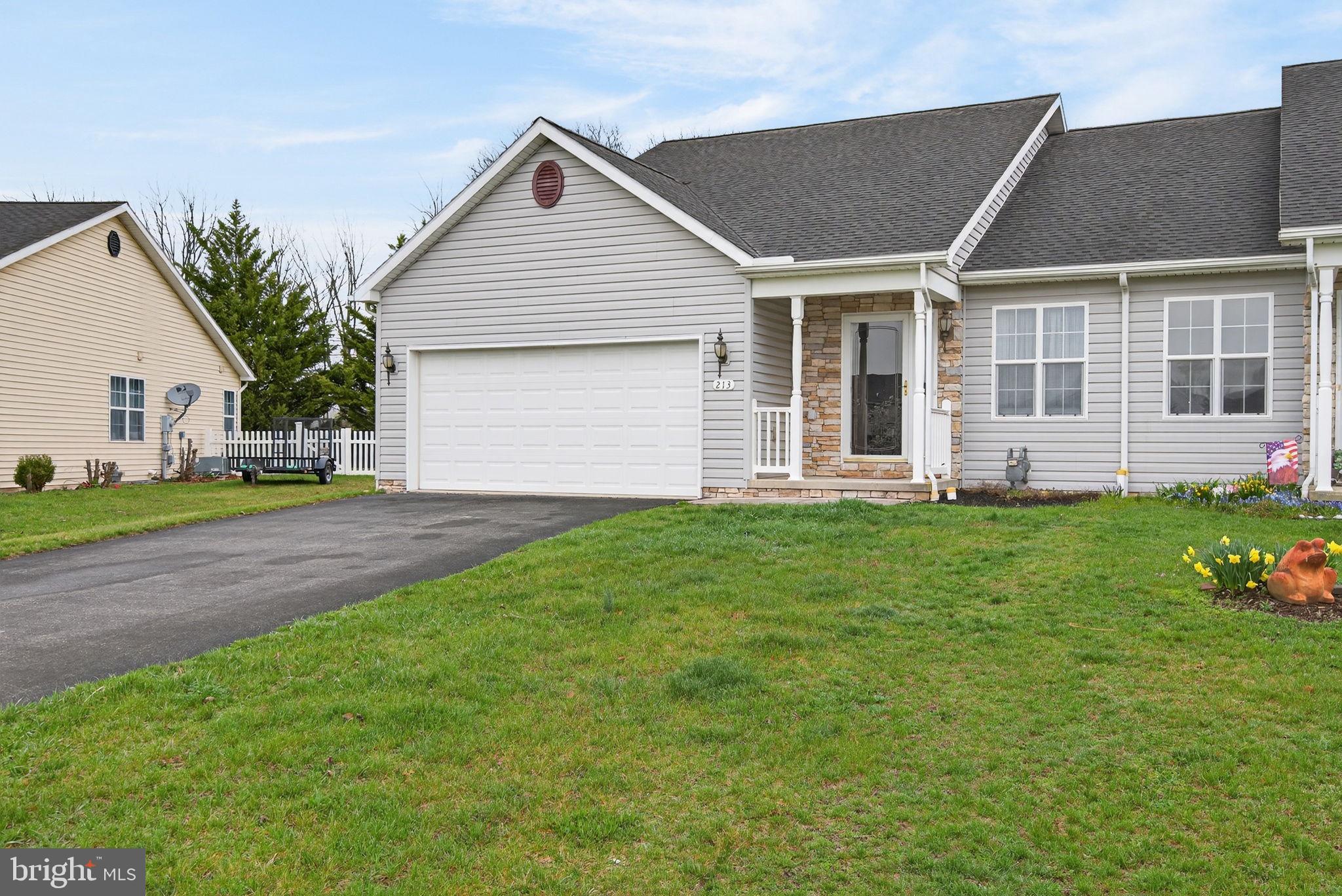 213 Maple Drive Hanover, PA 17331 - Photo 3 of 24 a front view of a house with a yard and green space