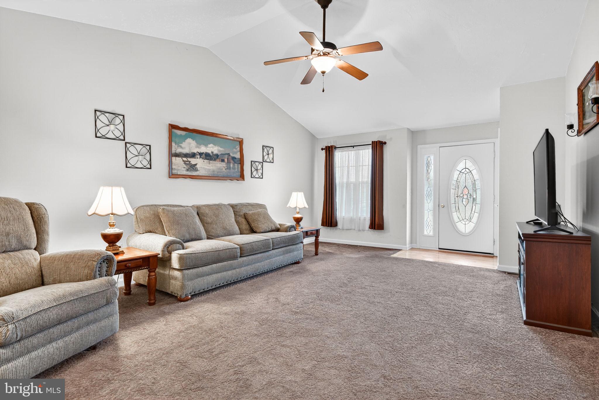 213 Maple Drive Hanover, PA 17331 - Photo 6 of 24 a living room with furniture a ceiling fan and a window