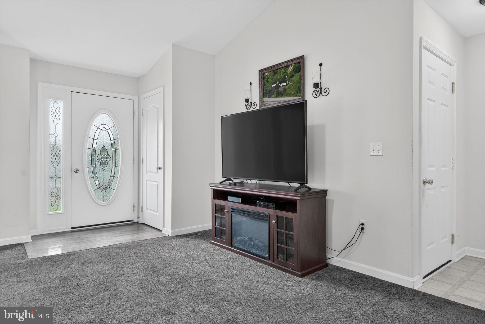 213 Maple Drive Hanover, PA 17331 - Photo 7 of 24 a living room with furniture and a flat screen tv