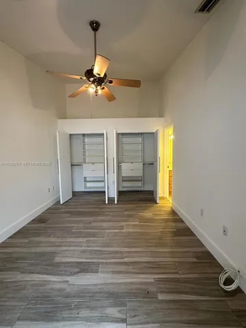 a view of a livingroom with wooden floor