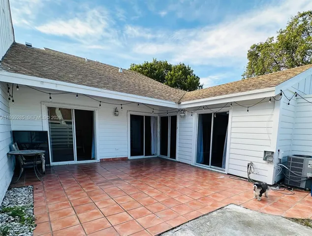 a view of a yard with large trees