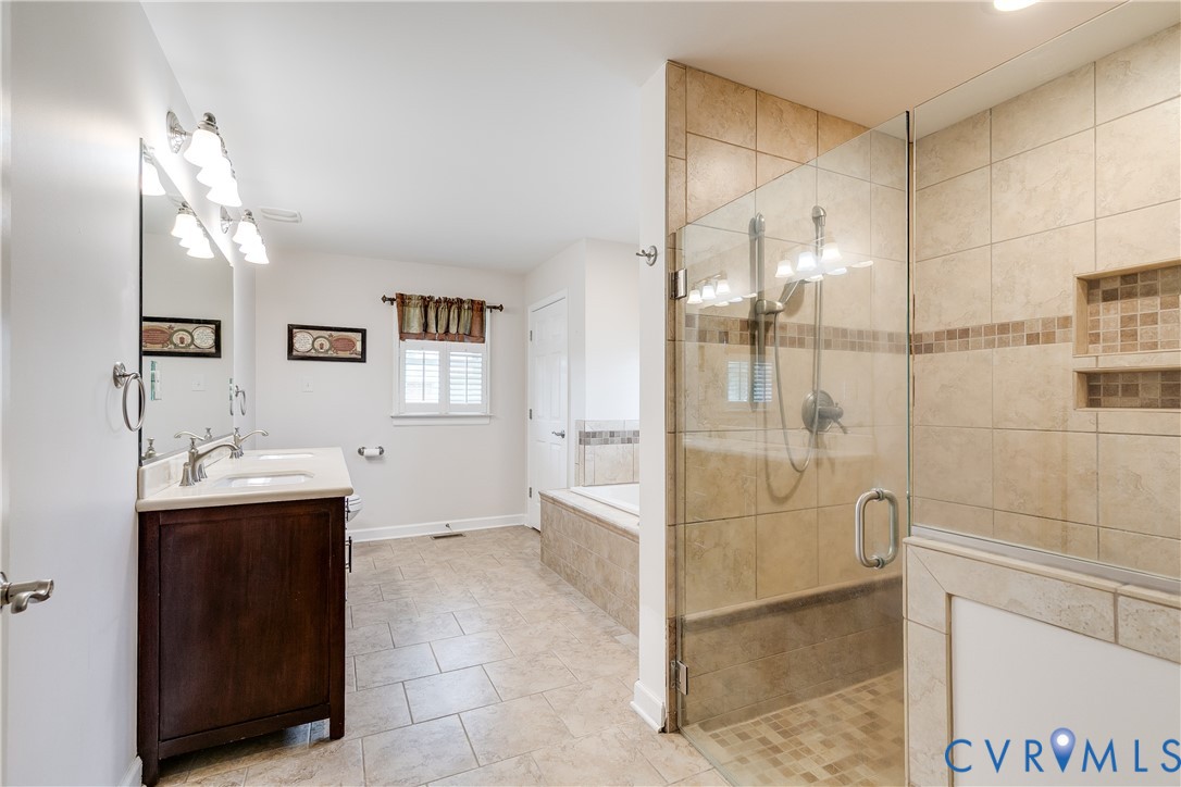 12365 Ashcake Road Ashland, VA 23005 - Photo 29 of 80 Spacious primary bathroom featuring a glass-enclos