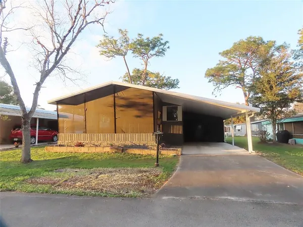 a view of a house with a yard and garage