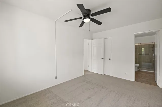 a view of a big room with carpet