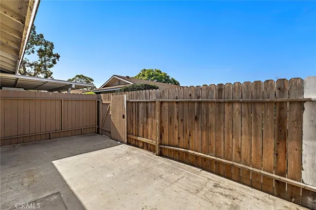 a view of outdoor space with wooden fence