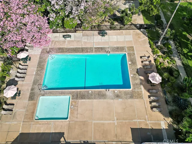 a view of swimming pool with a yard