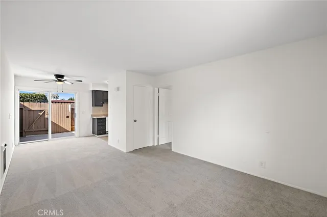 a view of empty room with furniture