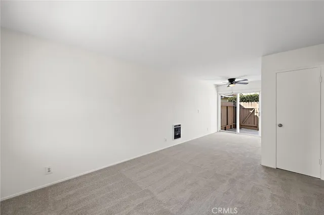 a view of empty room with windows