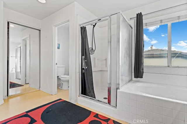 a bathroom with a bathtub and a shower