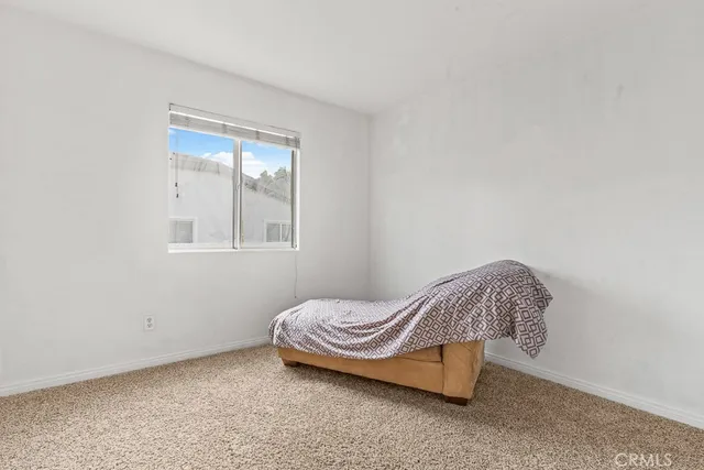 a room with a bed and a window