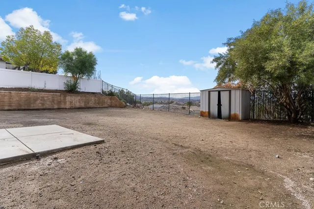 a view of a backyard of the house