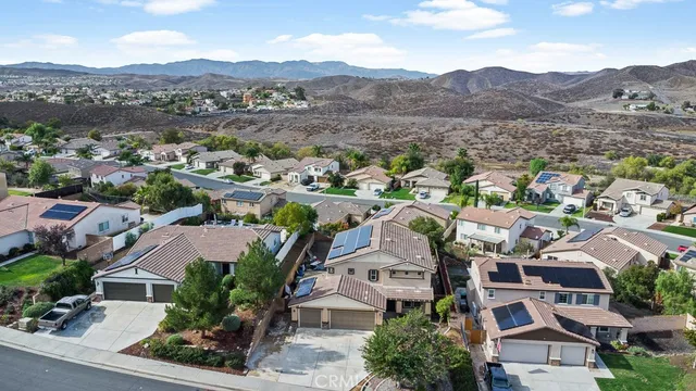 an aerial view of residential houses and lake view