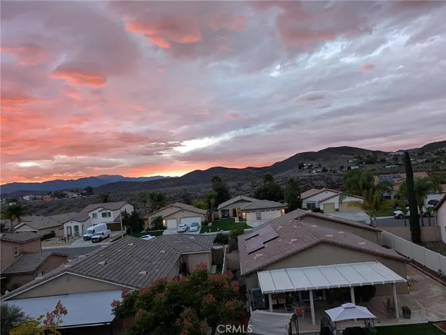 a view of multiple houses with a city street